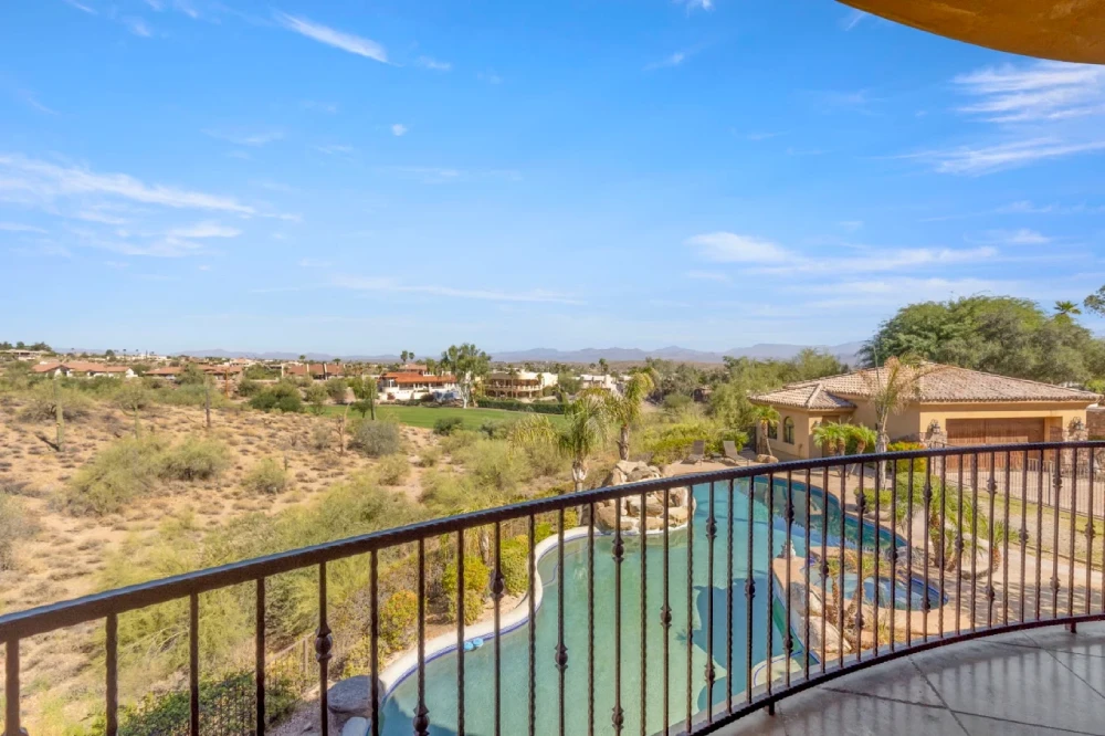 Balcony view over the residence pool and open desert landscape