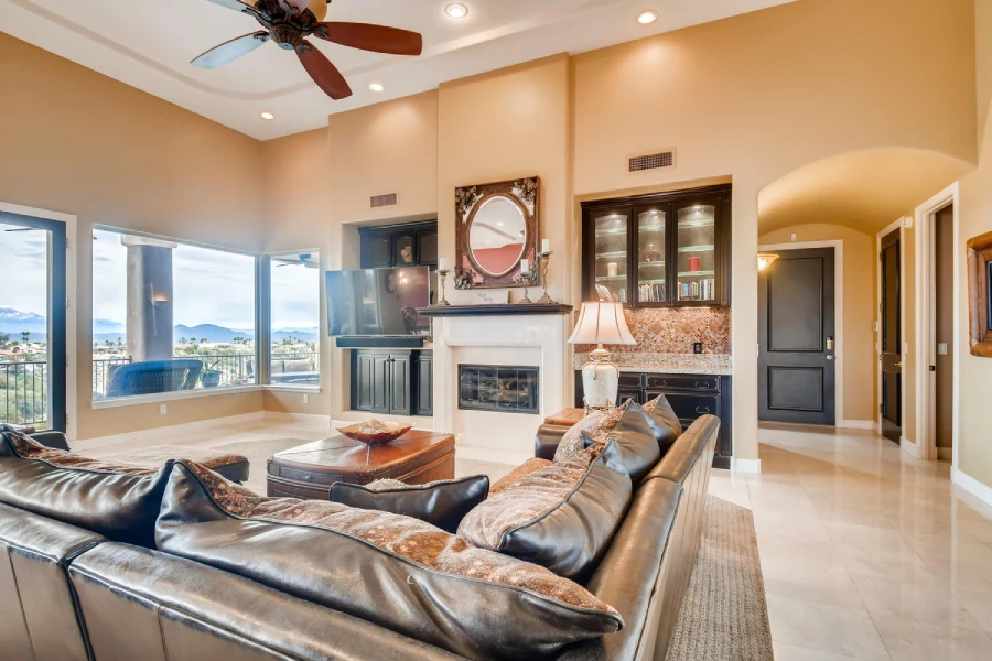 Open living room with fireplace and wide view windows